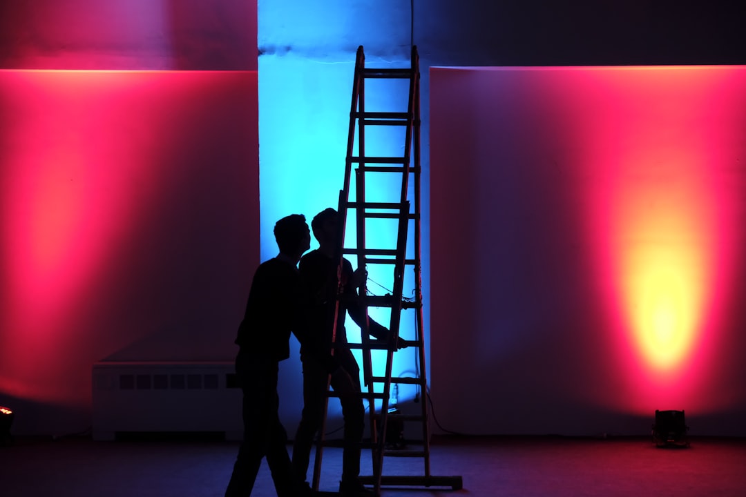 man-in-black-jacket-standing-on-black-ladder-d1svyyw-9-s